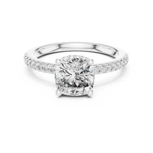 Cushion-cut halo engagement ring with pavé side stones in white gold

Elegant women’s engagement ring featuring cushion center and halo

Statement bridal ring with sparkling pavé side stones