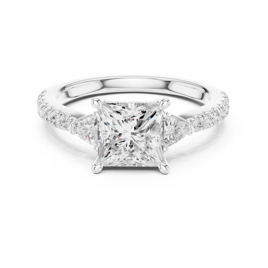 Three-stone engagement ring with princess-cut center and trillion-cut side diamonds in 935 silver

White gold engagement ring featuring princess center, trillion side stones, and pavé band

Modern women’s engagement ring with sparkling pavé accents