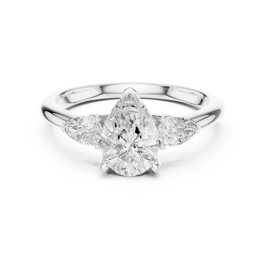 Pear-shaped three-stone engagement ring with lab-grown center diamond in 935 silver

White gold engagement ring featuring pear-cut center and two side diamonds

Elegant women’s three-stone engagement ring with lab-grown diamonds