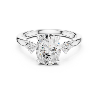 Oval-cut center engagement ring with pear-cut side stones in 935 silver

White gold three-stone engagement ring featuring oval and pear-cut diamonds

Elegant women’s engagement ring with large oval center and pear side stones