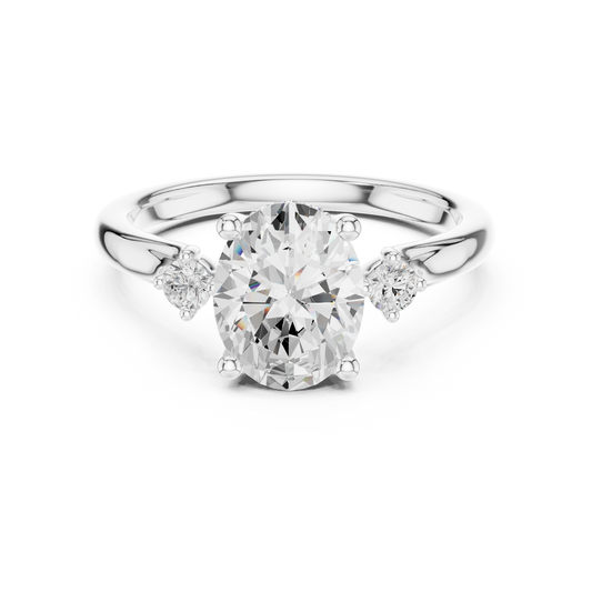 Oval-cut center engagement ring with pear-cut side stones in 935 silver

White gold three-stone engagement ring featuring oval and pear-cut diamonds

Elegant women’s engagement ring with large oval center and pear side stones
