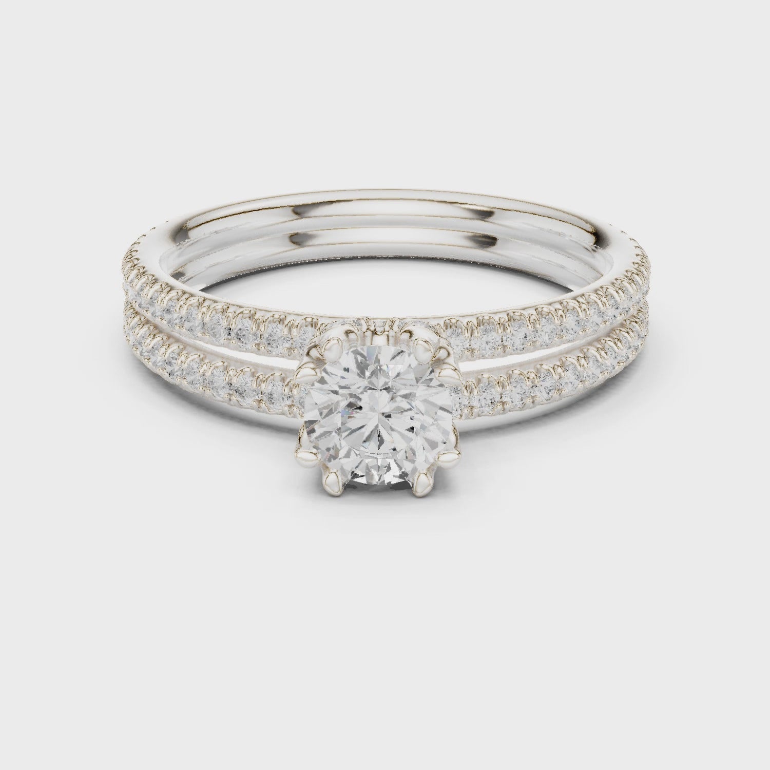 Round solitaire engagement ring with pavé band in white gold

Lab-grown diamond solitaire with pavé accent diamonds

Elegant women’s engagement ring with round center stone