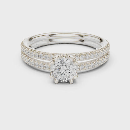 Round solitaire engagement ring with pavé band in white gold

Lab-grown diamond solitaire with pavé accent diamonds

Elegant women’s engagement ring with round center stone