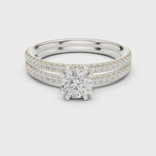 Round solitaire engagement ring with pavé band in white gold

Lab-grown diamond solitaire with pavé accent diamonds

Elegant women’s engagement ring with round center stone