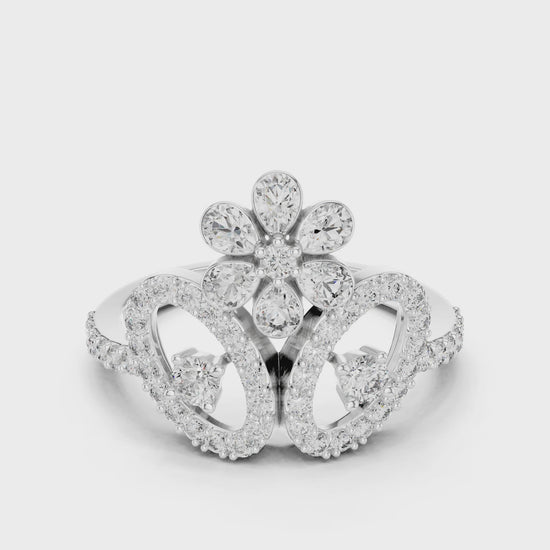 Pear and round diamond crown cocktail ring with polished metal finish