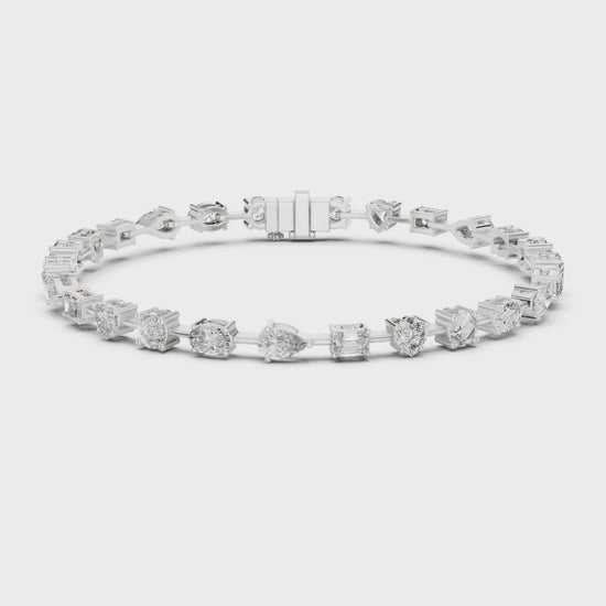 Mixed-cut diamond bracelet featuring multiple diamond shapes in a polished metal setting