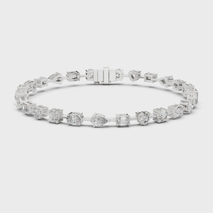Mixed-cut diamond bracelet featuring multiple diamond shapes in a polished metal setting