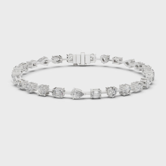 Mixed-cut diamond bracelet featuring multiple diamond shapes in a polished metal setting