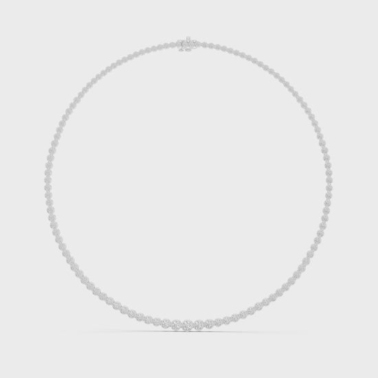 Diamond tennis necklace featuring continuous round brilliant-cut diamonds in polished metal
