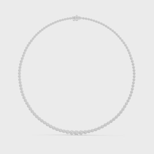 Diamond tennis necklace featuring continuous round brilliant-cut diamonds in polished metal