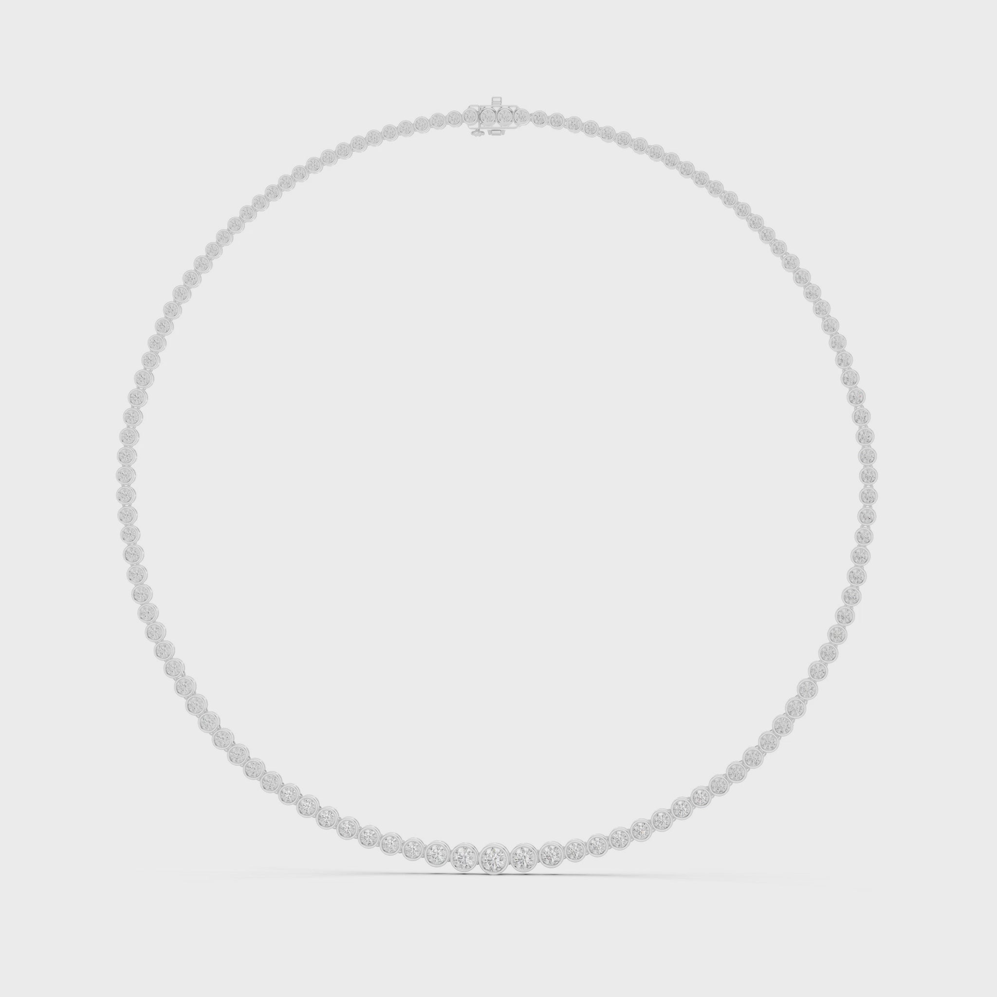 Diamond tennis necklace featuring continuous round brilliant-cut diamonds in polished metal