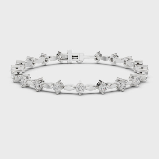 Alternating marquise and round diamond tennis bracelet with polished metal setting