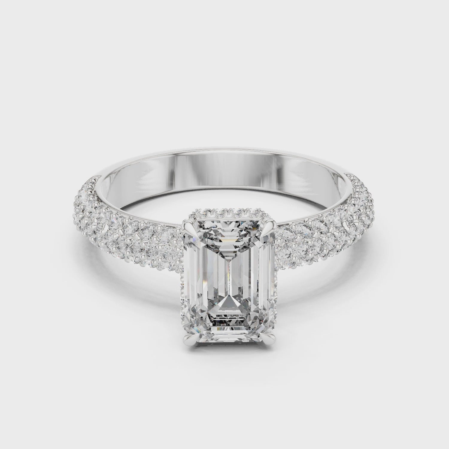 Emerald-cut lab-grown diamond engagement ring with hidden halo

Pavé-set shank engagement ring in white gold

Modern and elegant emerald-cut bridal ring