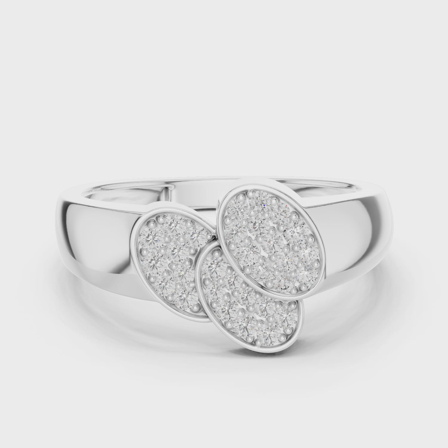 Diamond four-leaf clover ring with polished metal band and sparkling diamonds