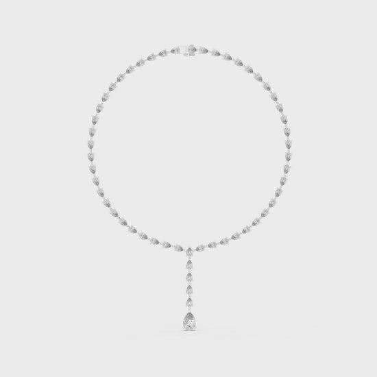 Pear diamond tennis necklace featuring round diamonds with pear-shaped drop pendant in polished metal