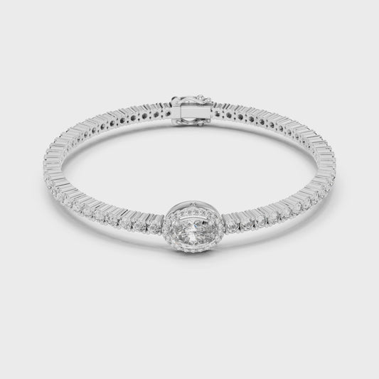Tennis bracelet featuring an oval-cut center diamond with continuous sparkle