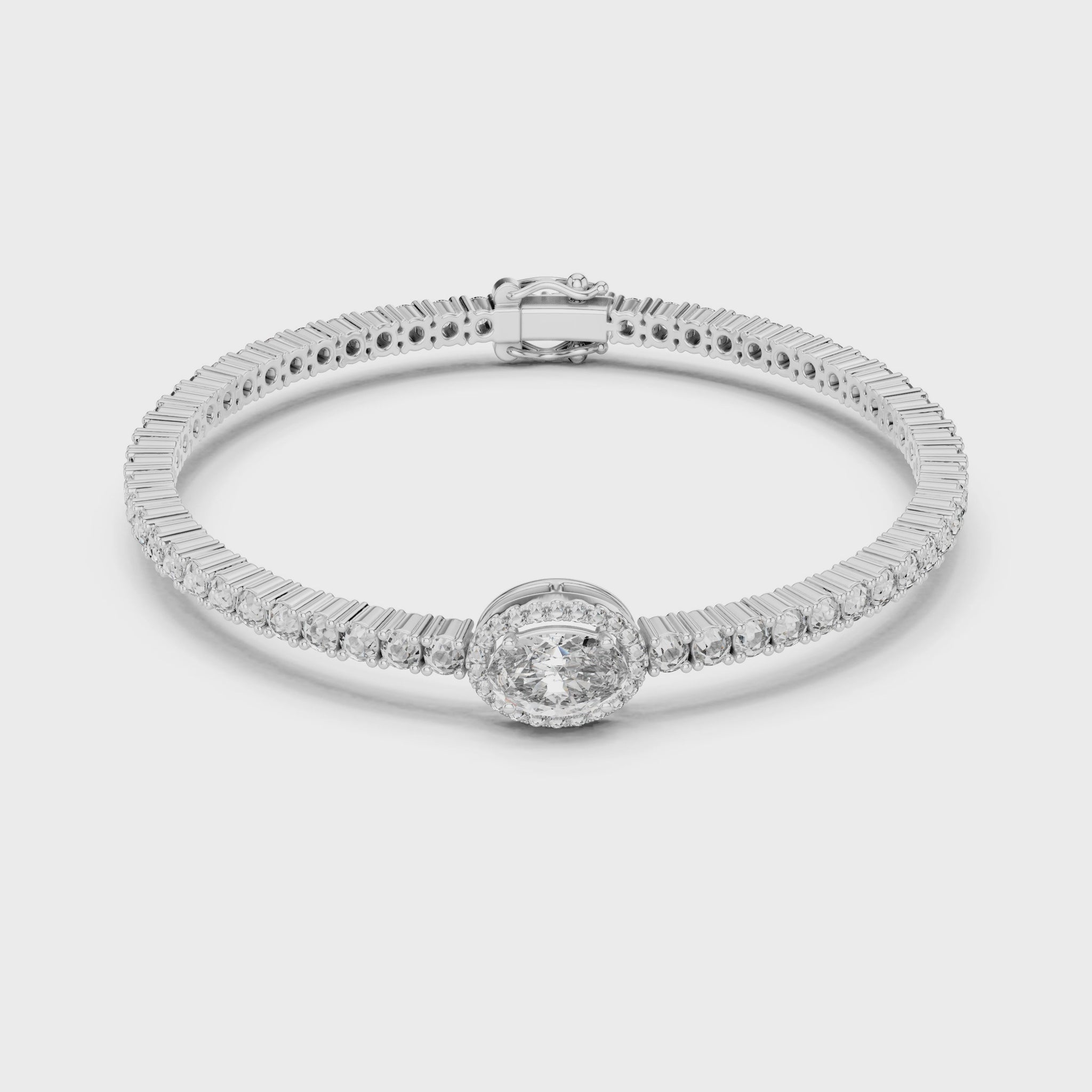 Tennis bracelet featuring an oval-cut center diamond with continuous sparkle