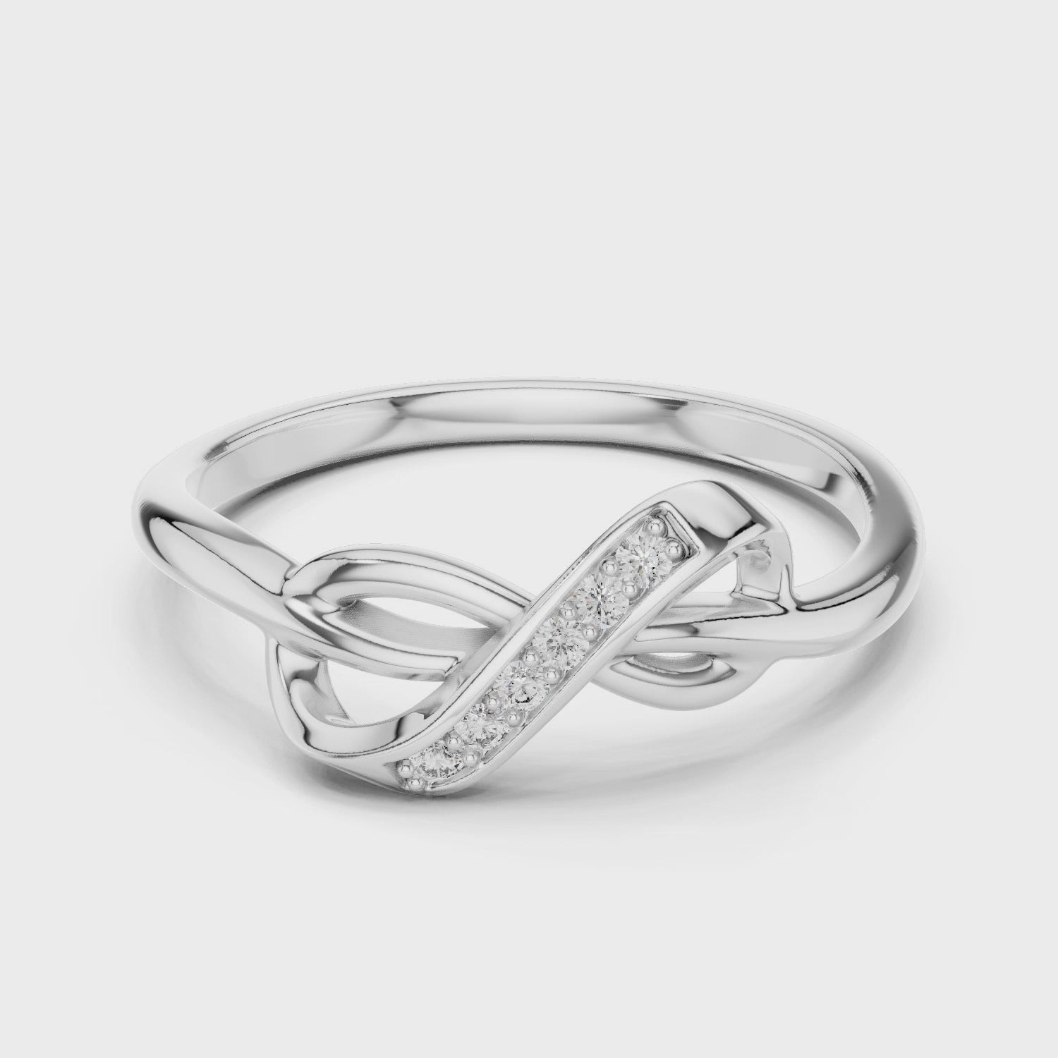 Silver pavé infinity ring with sparkling diamonds and high-polish finish