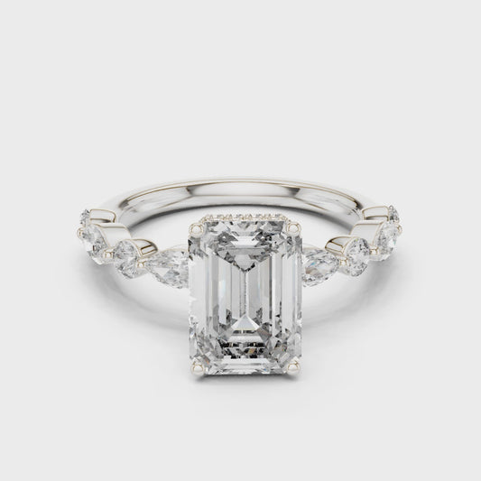 Emerald-cut lab-grown diamond engagement ring with floating round-cut side diamonds

Modern engagement ring with emerald-cut center and floating pavé accents

Elegant bridal ring featuring emerald center stone and floating diamonds