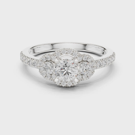 Halo three-stone lab-grown diamond engagement ring

Round-cut center stones with halo pavé diamonds

Elegant three-stone bridal engagement ring in white gold