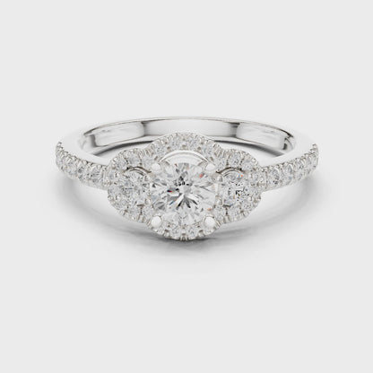 Halo three-stone lab-grown diamond engagement ring

Round-cut center stones with halo pavé diamonds

Elegant three-stone bridal engagement ring in white gold
