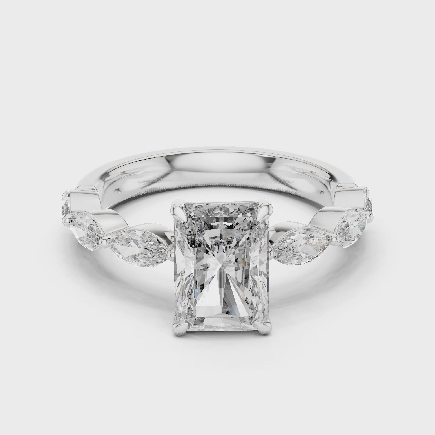 Radiant-cut moissanite ring with marquise side stones

Hidden halo moissanite engagement ring in white gold

Luxury radiant moissanite ring for women