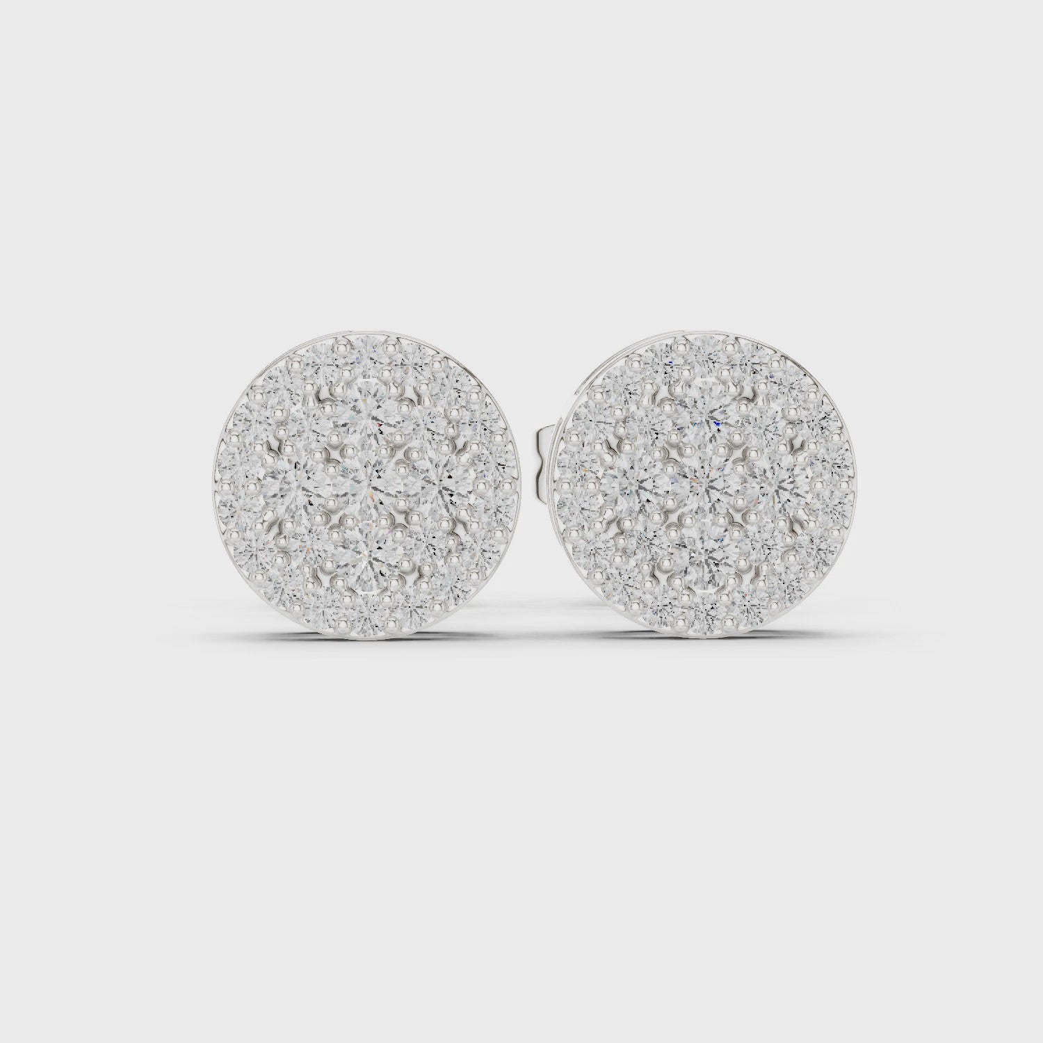 Pair of round cluster diamond stud earrings in white gold

Elegant women’s stud earrings featuring circular diamond clusters

Timeless fine jewelry earrings with sparkling cluster design