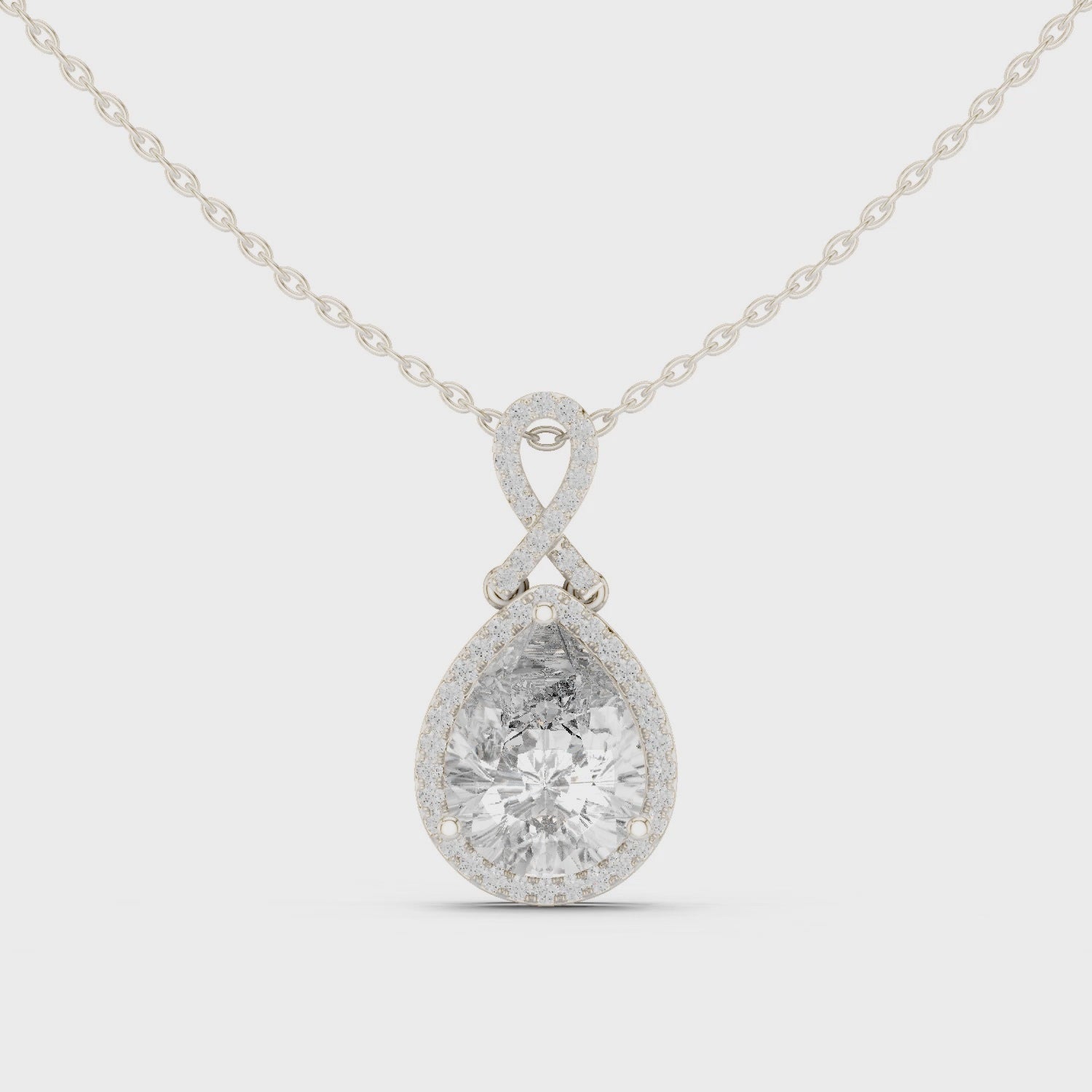 Pear-shaped lab-grown diamond halo pendant necklace

Pear diamond halo pendant in white gold

Teardrop diamond halo pendant close-up