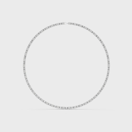 Emerald and round diamond tennis necklace featuring alternating cuts in a high-polish setting