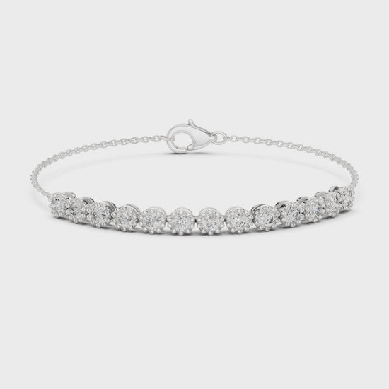 Classic diamond tennis bracelet with individually set round diamonds on a delicate chain