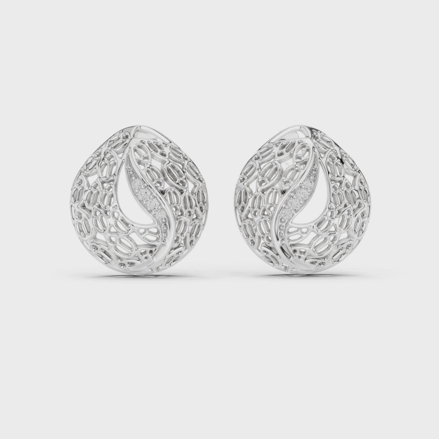 Silver filigree teardrop stud earrings featuring intricate artisan detailing and high-polish finish