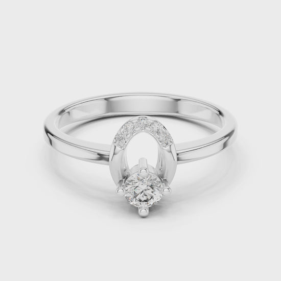Horseshoe engagement ring featuring a brilliant diamond symbolizing luck and love