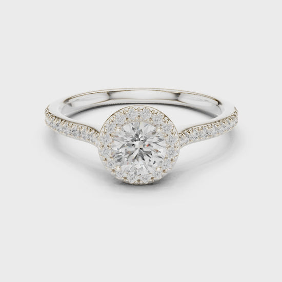 Round-cut halo diamond ring in white gold

Lab-grown diamond center with pavé halo

Elegant bridal ring featuring round halo design