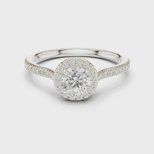 Round-cut halo diamond ring in white gold

Lab-grown diamond center with pavé halo

Elegant bridal ring featuring round halo design