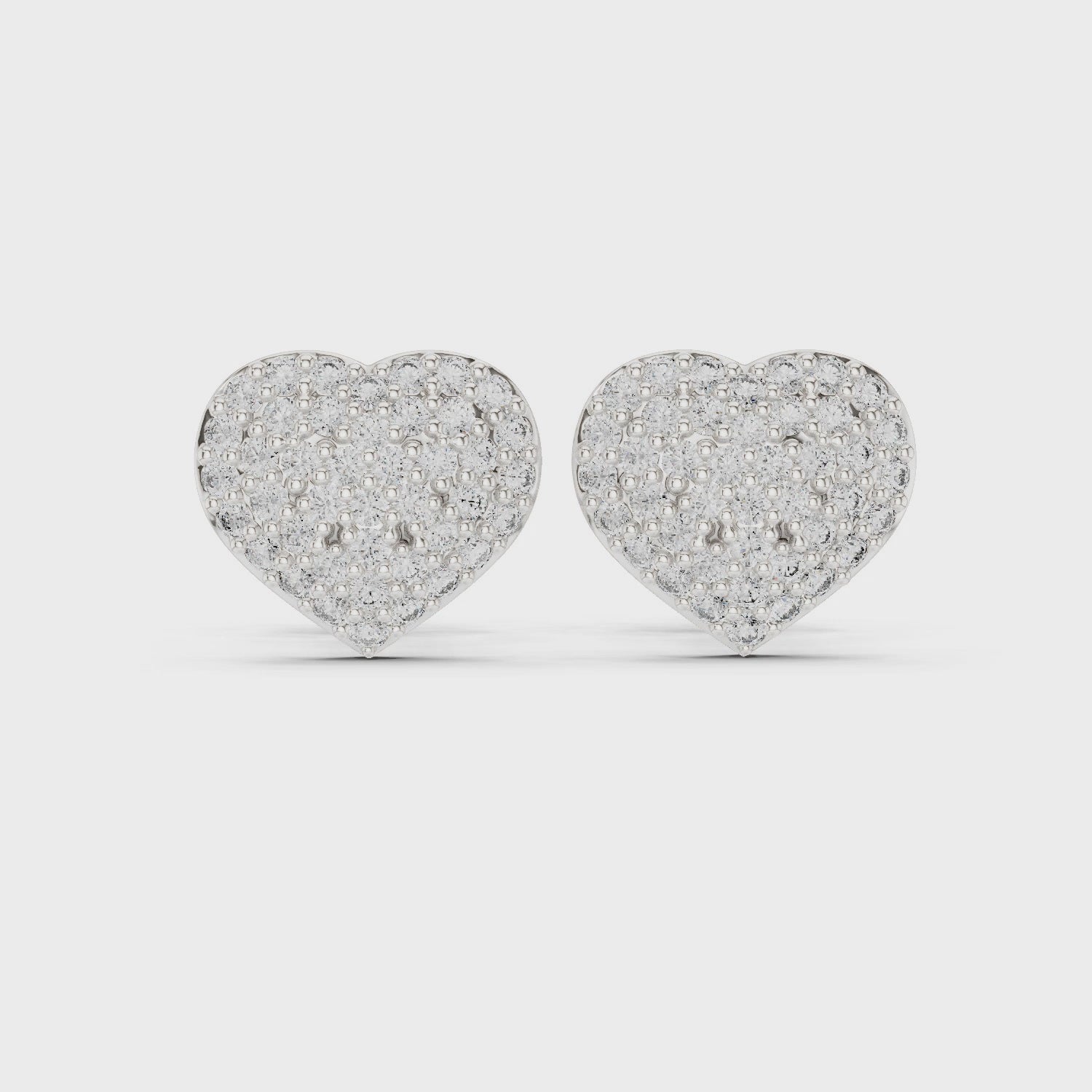Pair of Valentina pavé diamond heart stud earrings in white gold

Elegant women’s earrings featuring heart-shaped pavé diamonds

Timeless fine jewelry earrings with sparkling romantic design