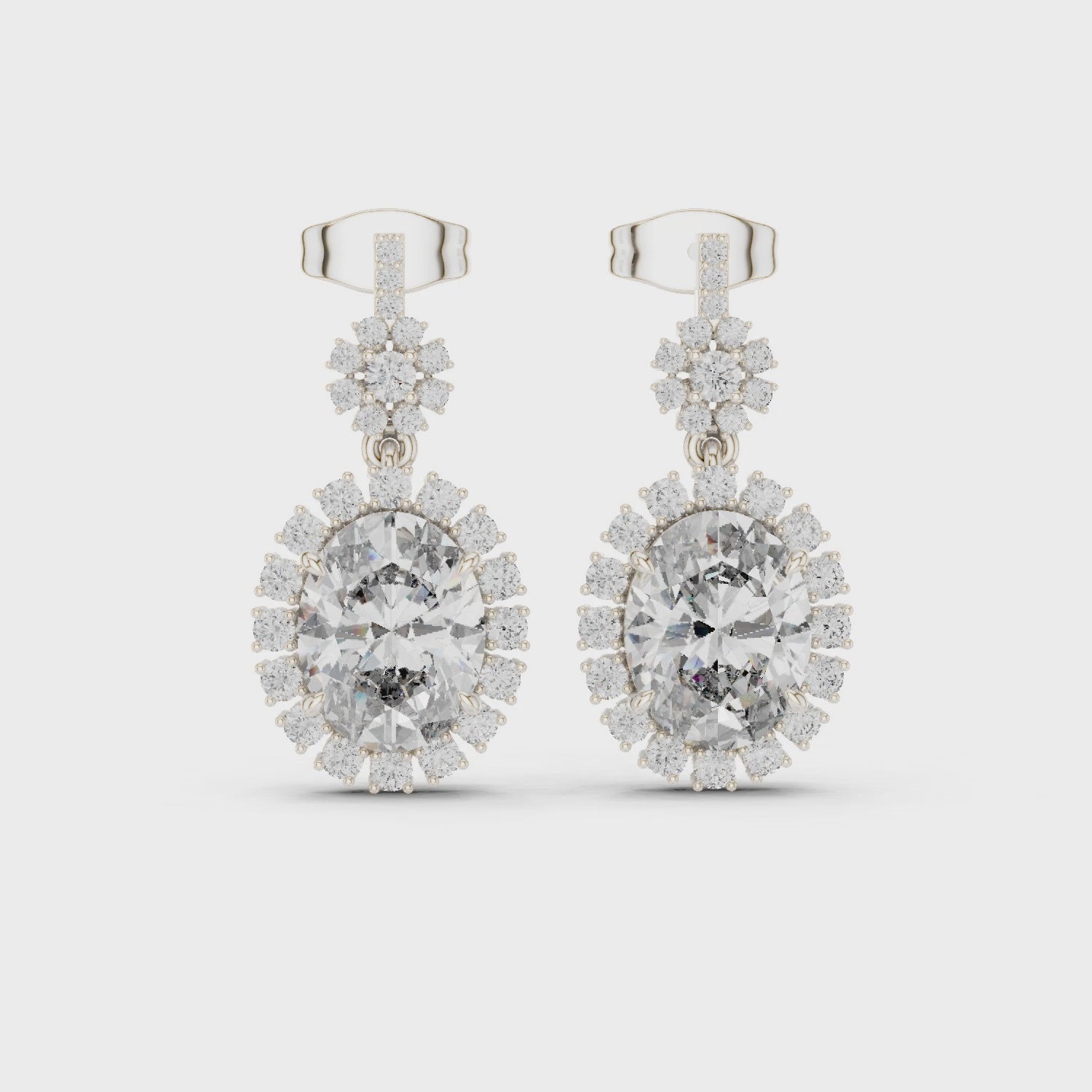 Starburst halo oval lab-grown diamond drop earrings in sterling silver

Oval diamond halo drop earrings with round accent diamonds

Elegant starburst diamond drop earrings for women