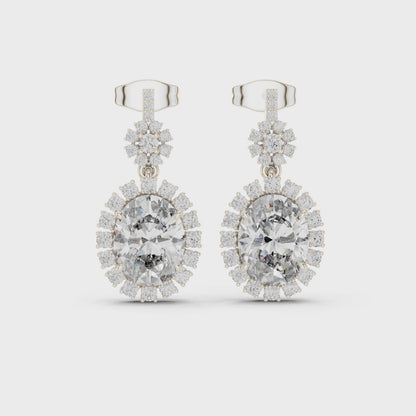 Starburst halo oval lab-grown diamond drop earrings in sterling silver

Oval diamond halo drop earrings with round accent diamonds

Elegant starburst diamond drop earrings for women