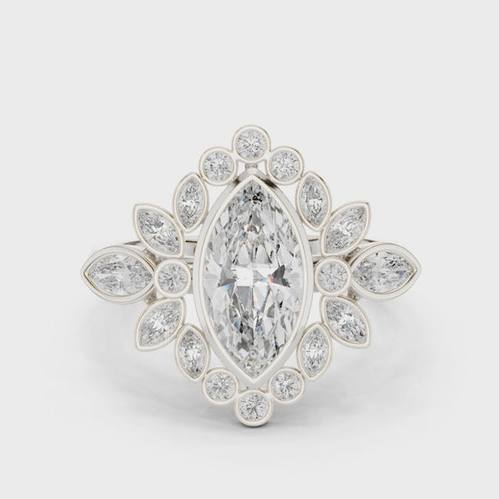 Marquise-cut bezel-set diamond ring with halo of round and marquise diamonds

Lab-grown diamond marquise halo engagement ring

Elegant bridal ring featuring marquise and round halo diamonds