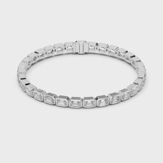 Emerald-cut diamond tennis bracelet with bezel setting in a modern luxury design