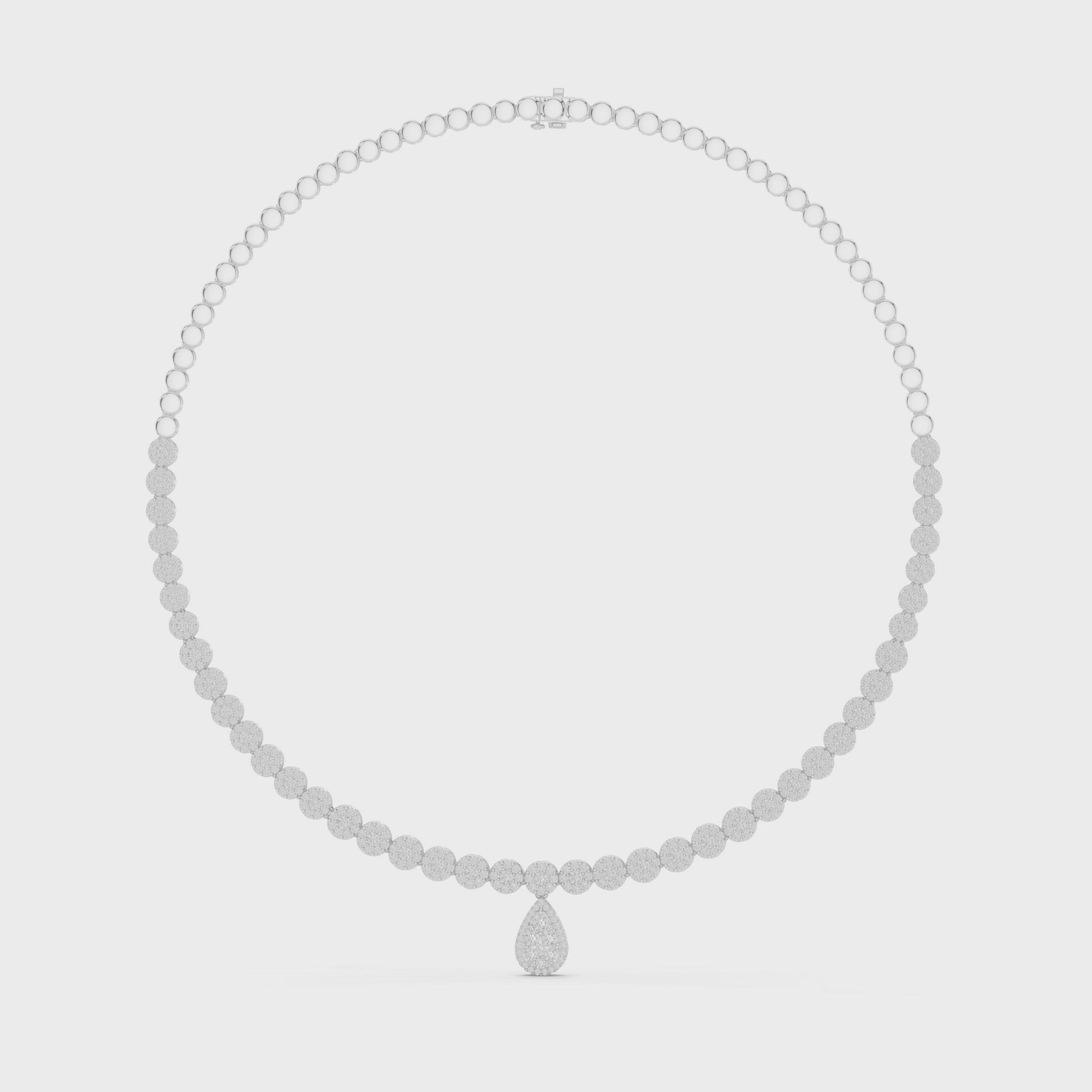 Round diamond necklace featuring a pear-shaped diamond centerpiece on polished metal