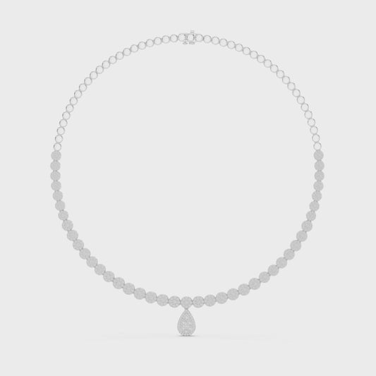 Round diamond necklace featuring a pear-shaped diamond centerpiece on polished metal