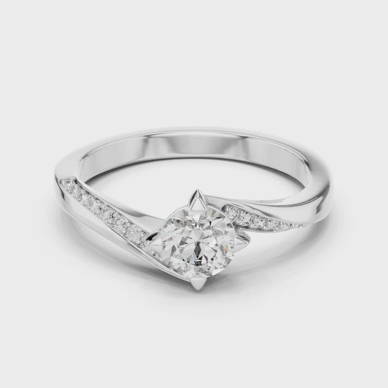Twist engagement ring with brilliant-cut solitaire and accent diamonds

Lab-grown diamond twist band engagement ring in white gold

Close-up of twisted band solitaire diamond ring