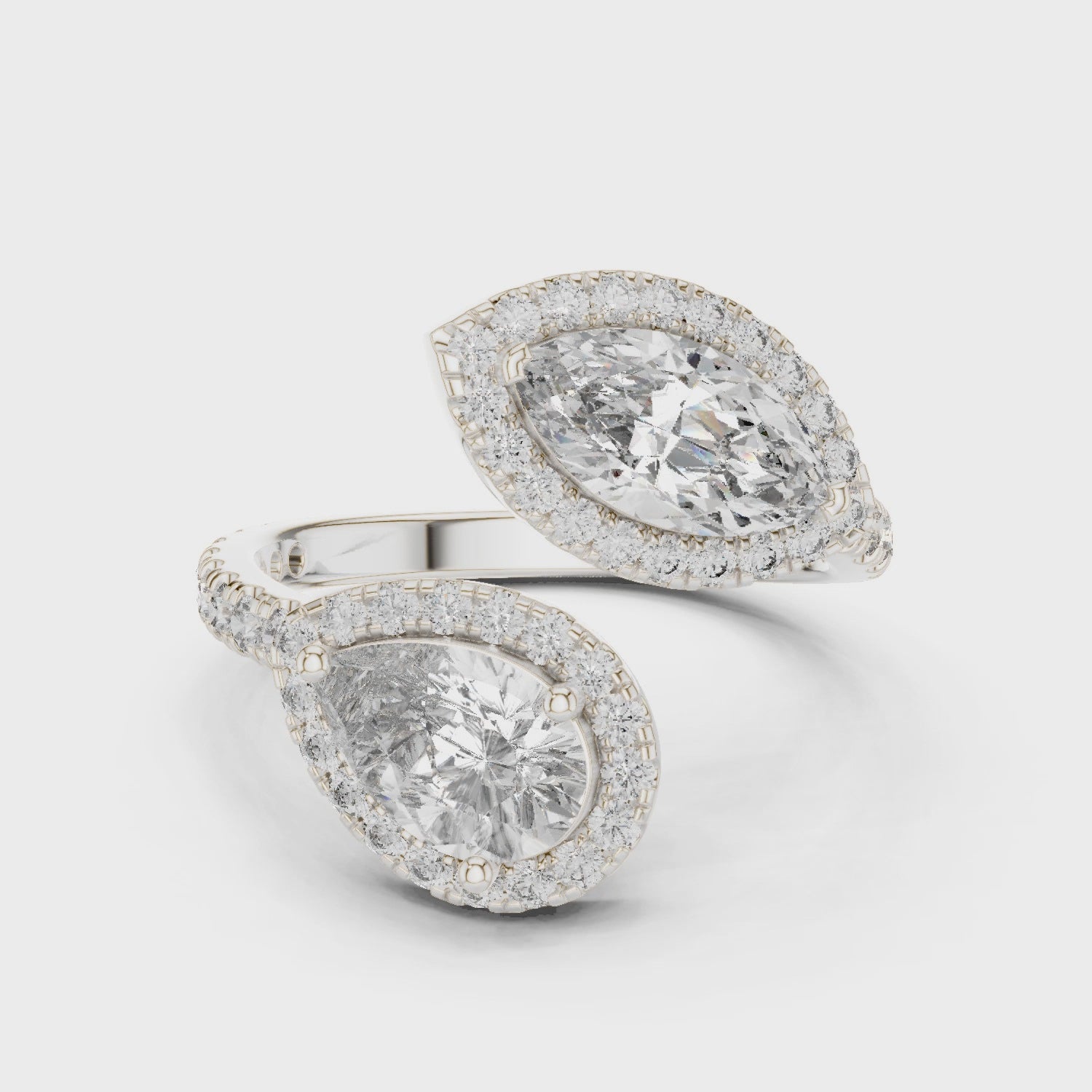 Double pear halo lab-grown diamond bypass ring

Pear-shaped diamond bypass ring with pavé halos

Toi et Moi pear halo diamond ring