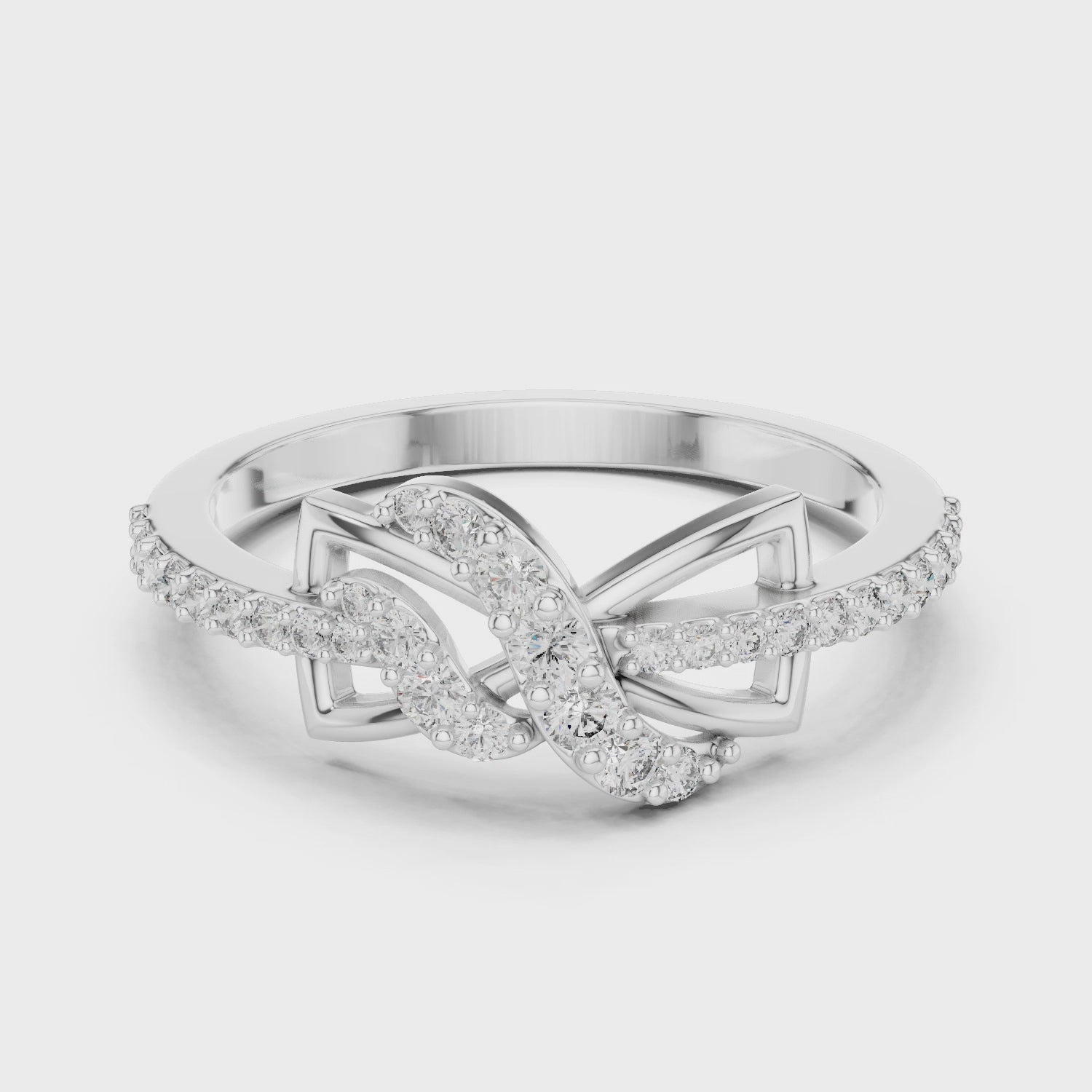 Infinity knot diamond ring symbolizing eternal love in a high-polish finish