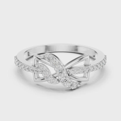 Infinity knot diamond ring symbolizing eternal love in a high-polish finish