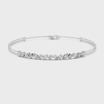 Multi-shape diamond bracelet featuring mixed-cut diamonds in a polished metal setting