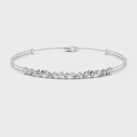 Multi-shape diamond bracelet featuring mixed-cut diamonds in a polished metal setting