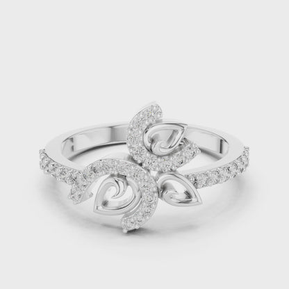 Diamond floral swirl ring featuring a curved leaf cluster design in a high-polish finish