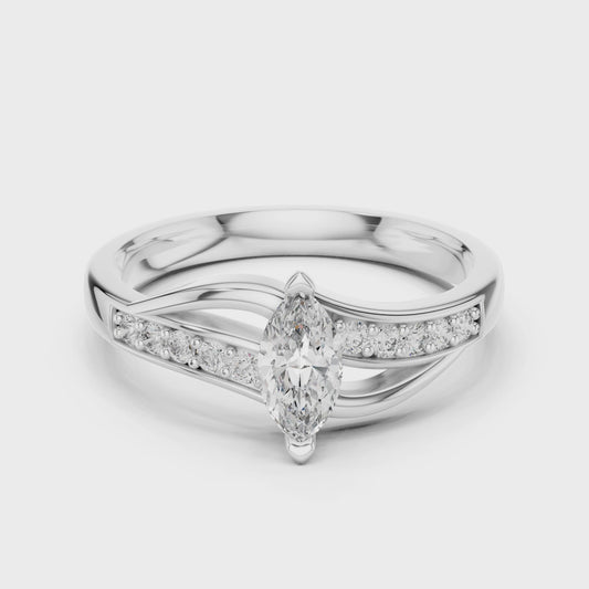 Marquise twisted ring featuring a marquise-cut diamond with a modern twisted band