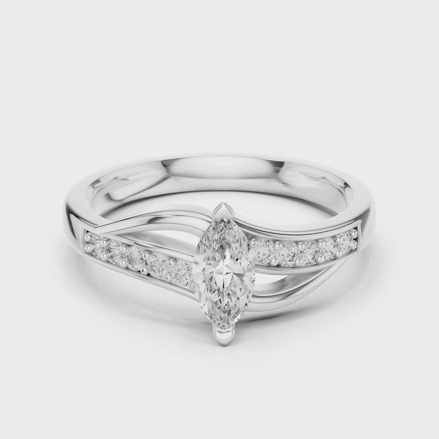 Marquise twisted ring featuring a marquise-cut diamond with a modern twisted band